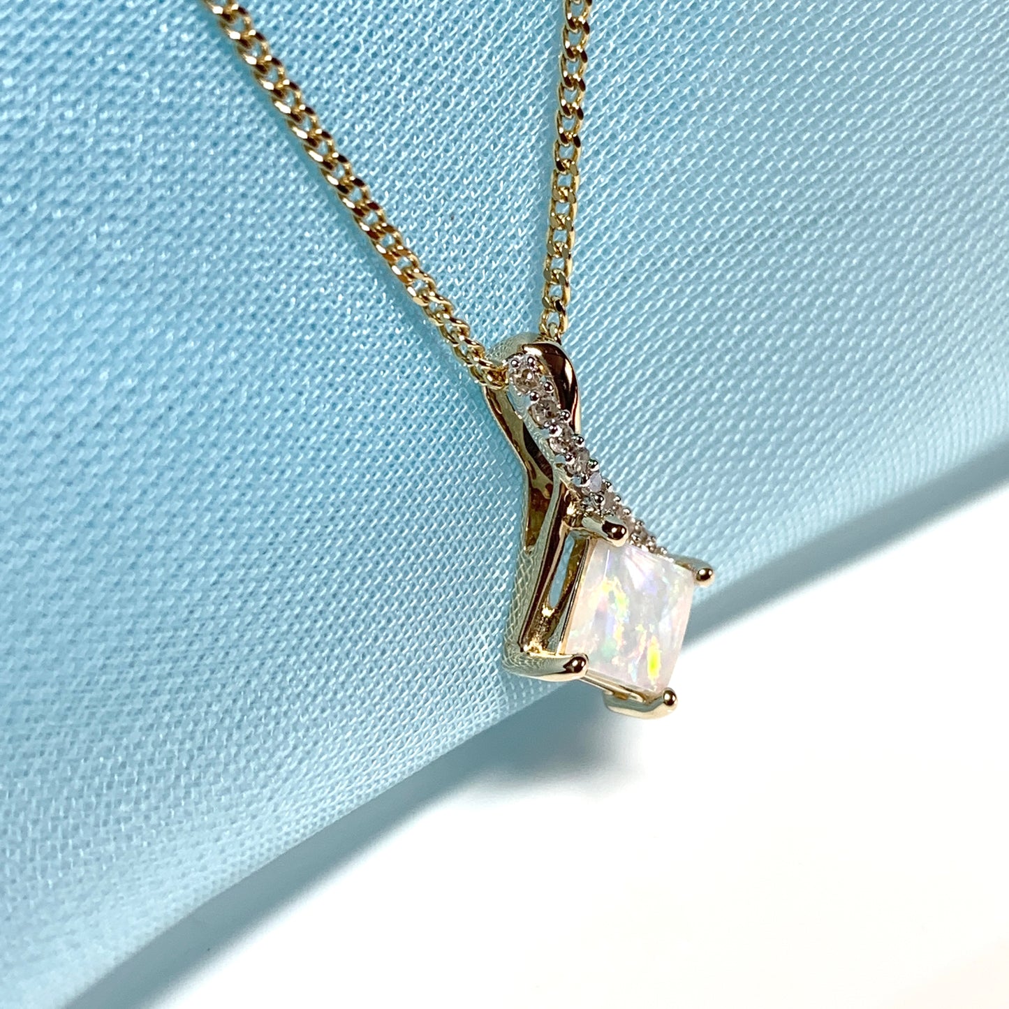 Gold opal and diamond necklace pendent