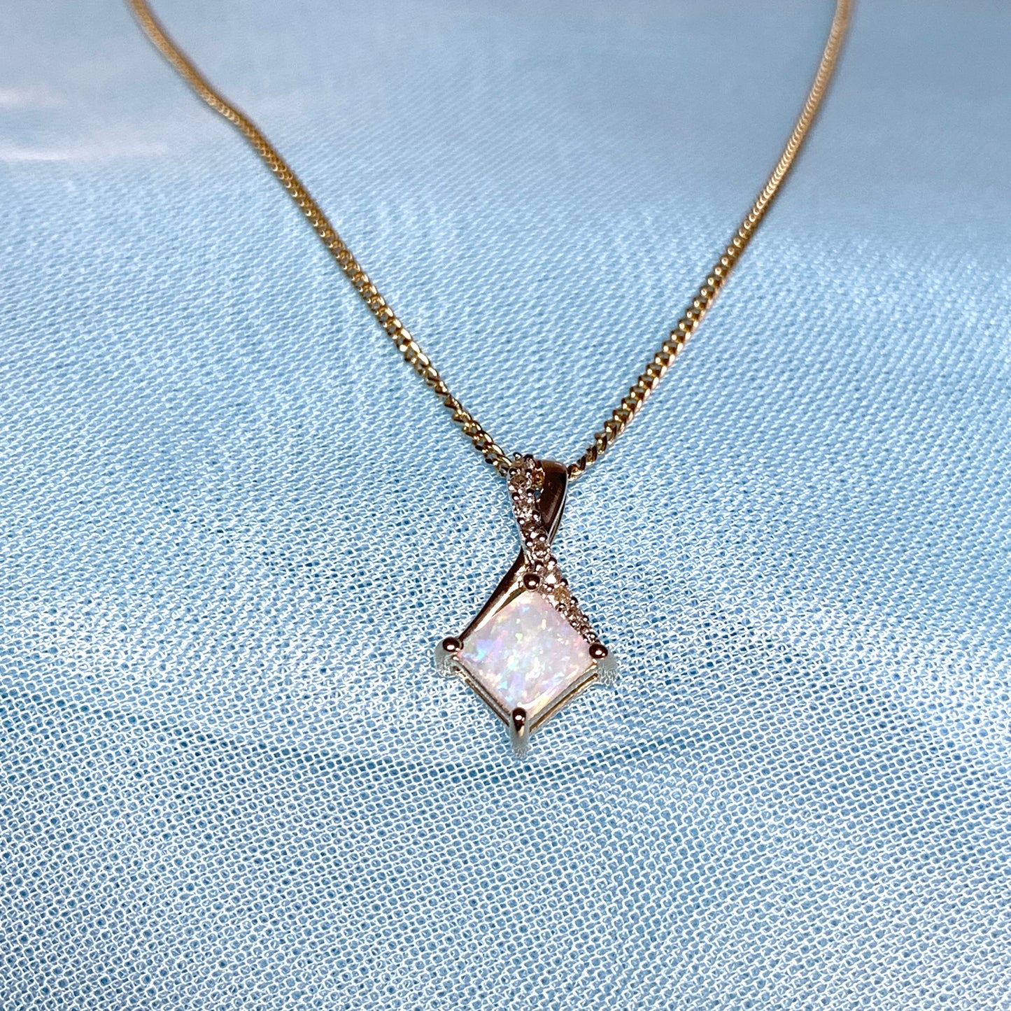 Gold opal and diamond necklace pendent