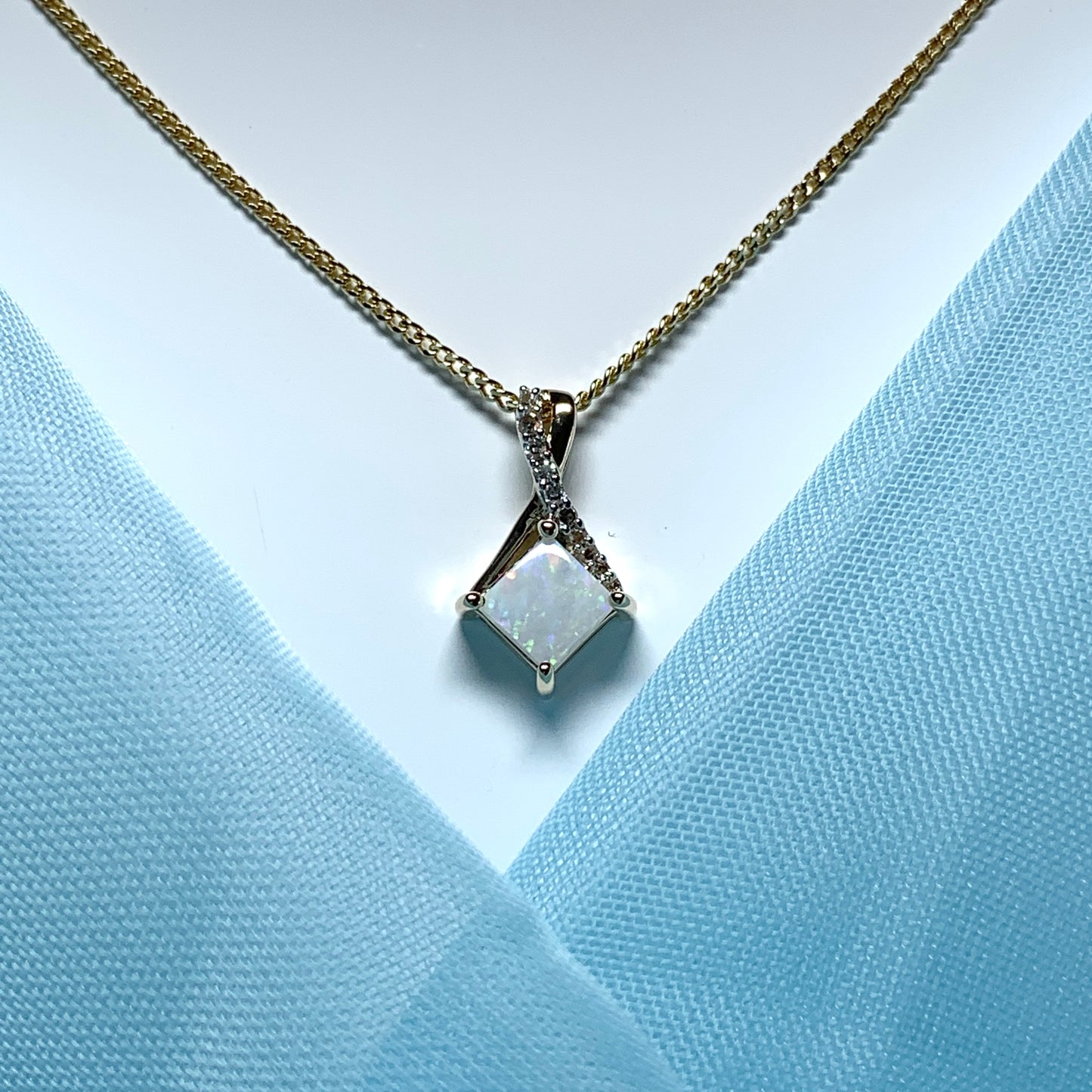 Gold opal and diamond necklace pendent