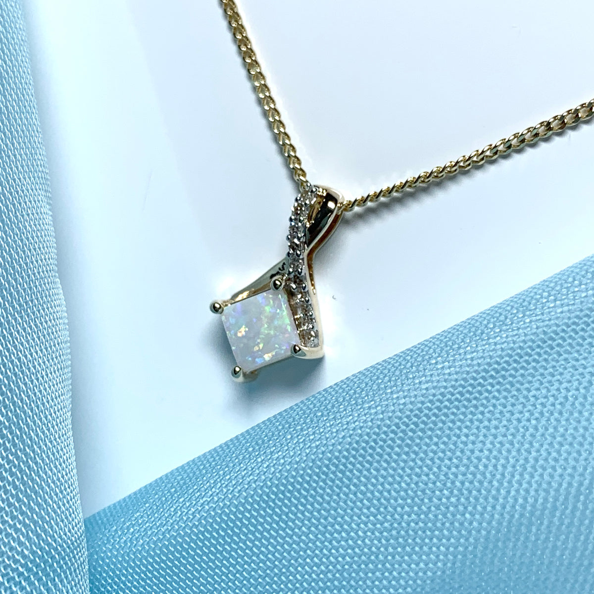 Gold opal and diamond necklace pendent