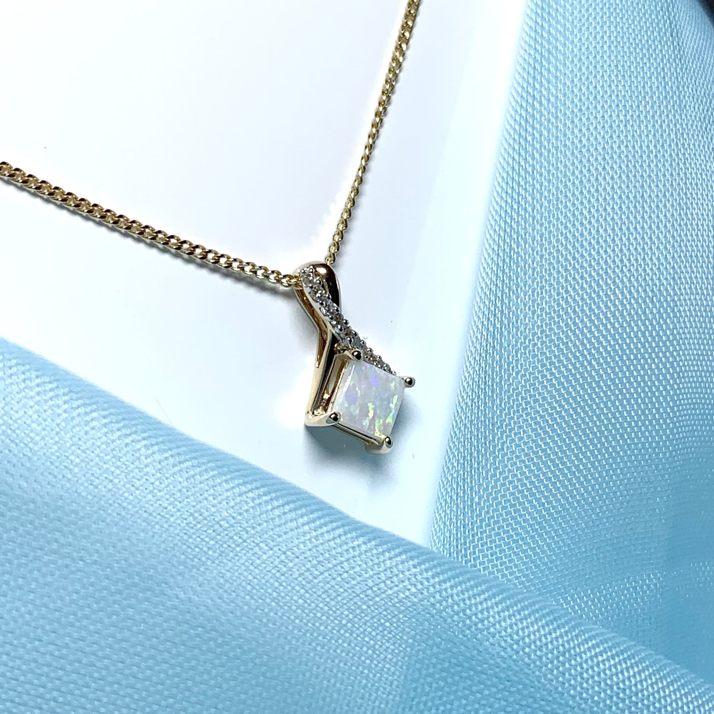 Gold opal and diamond necklace pendent