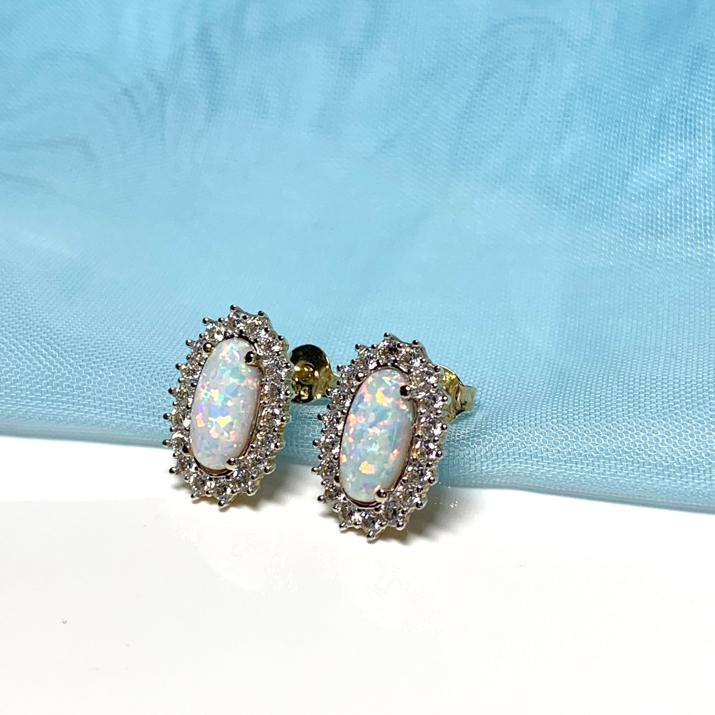 Gold oval opal and cubic zirconia earrings