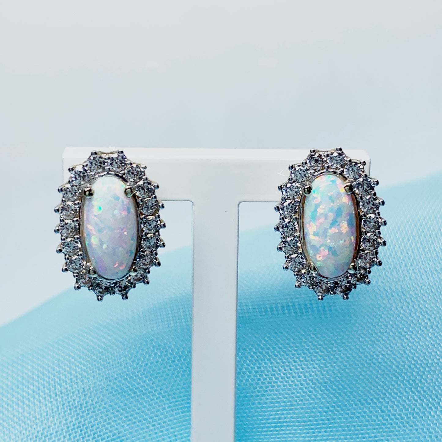 Gold oval opal and cubic zirconia earrings