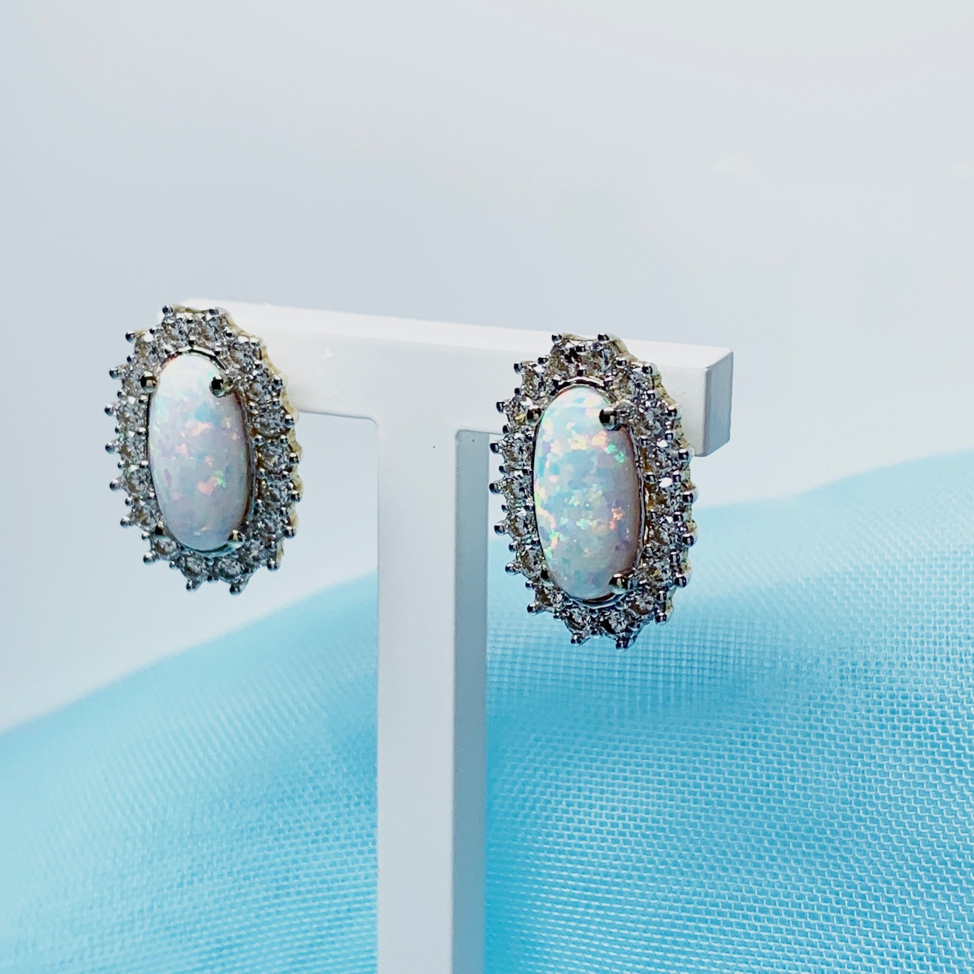 Gold oval opal and cubic zirconia earrings