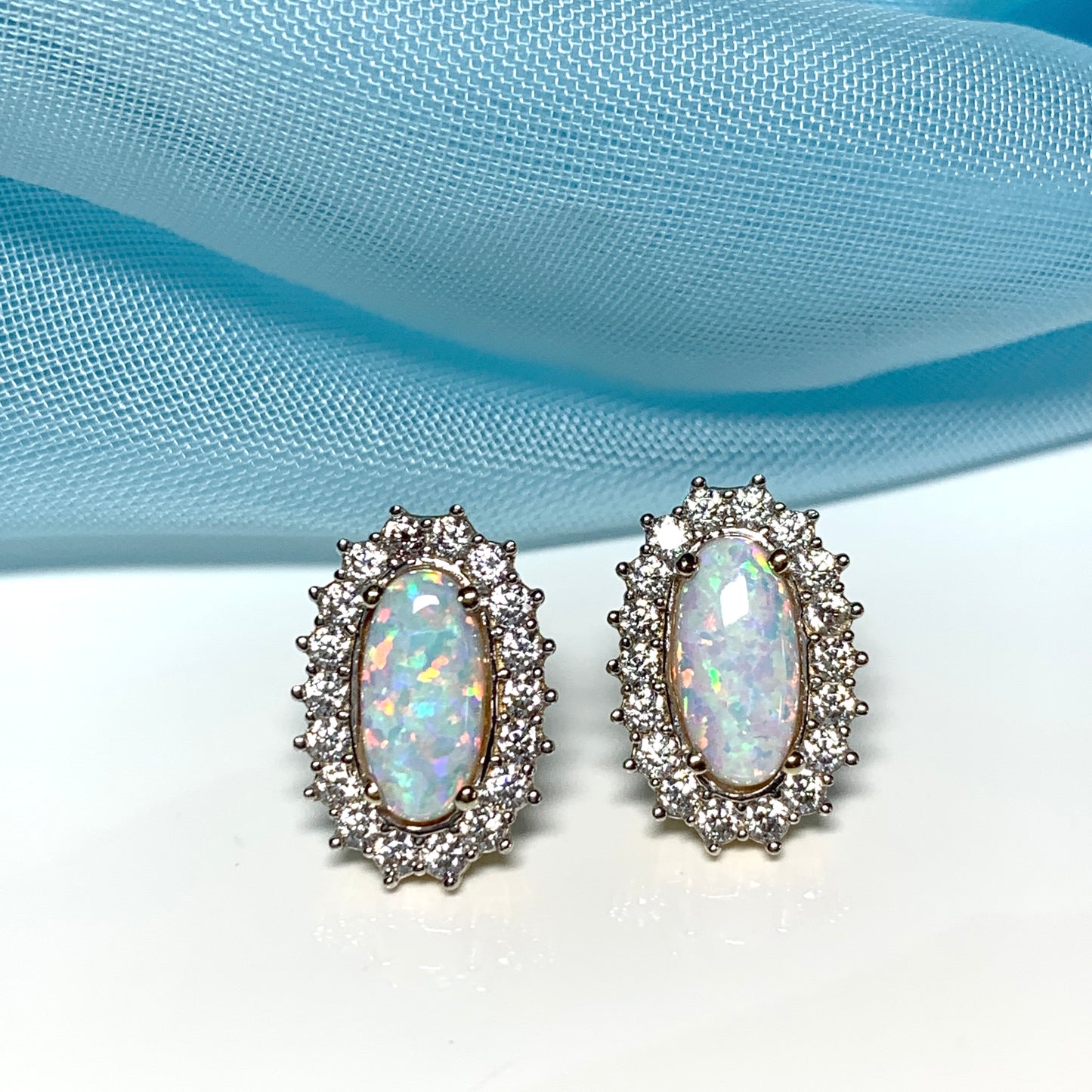 Gold oval opal and cubic zirconia earrings