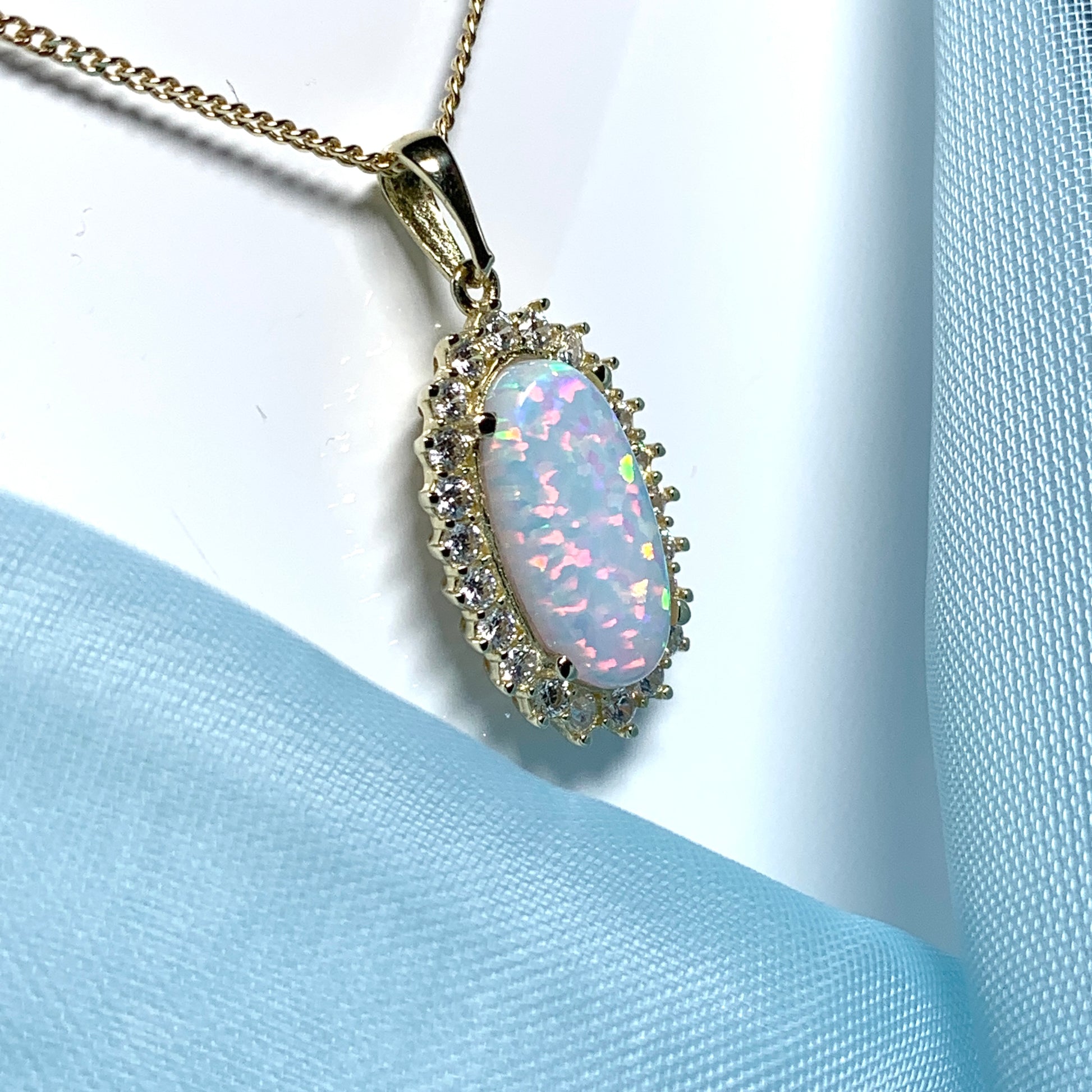 Gold oval opal and cubic zirconia necklace pendent