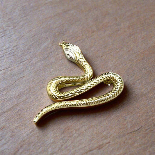 Yellow gold snake brooch