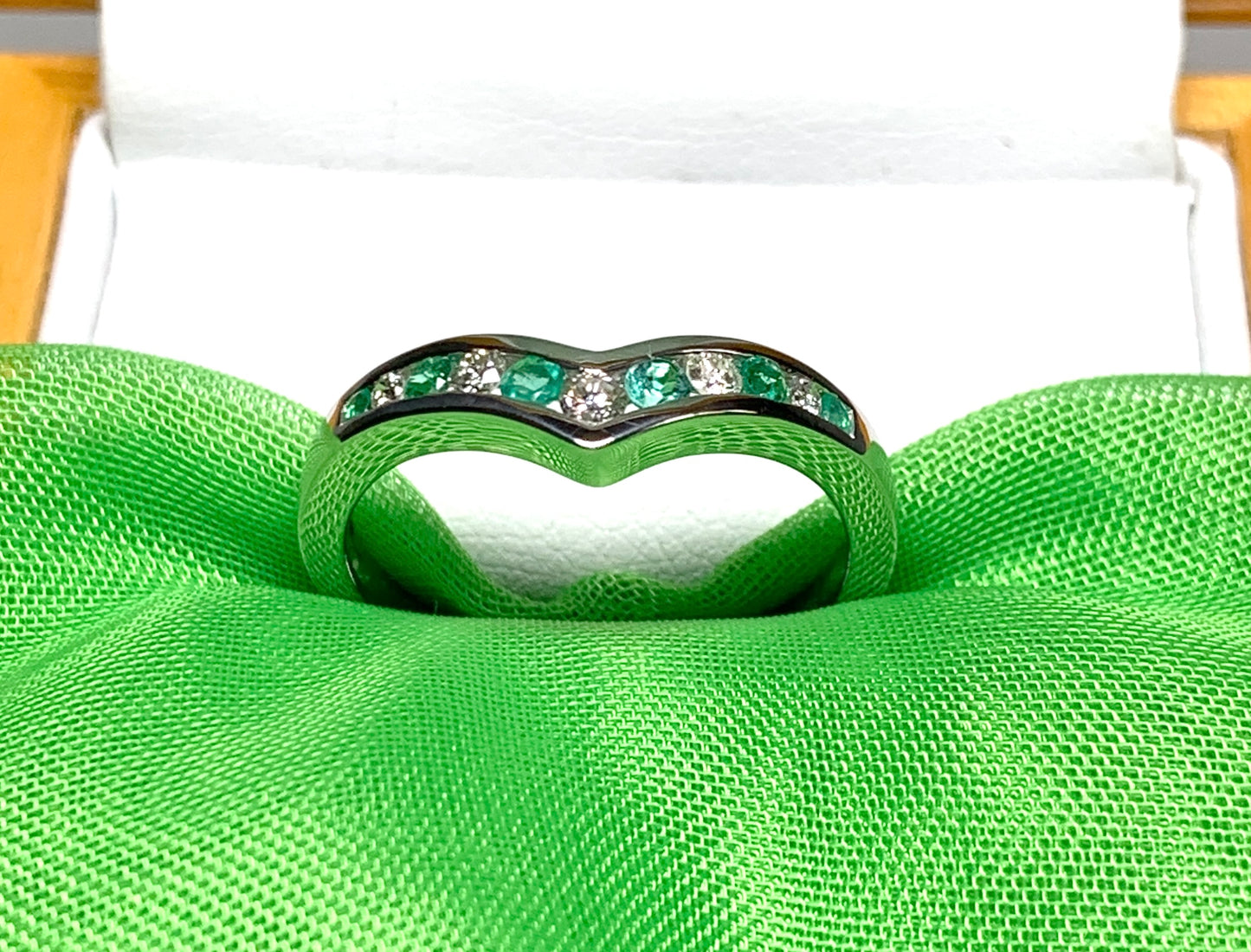 Green Emerald And Diamond White Gold Wishbone Ring Rubbed Smooth Over Setting