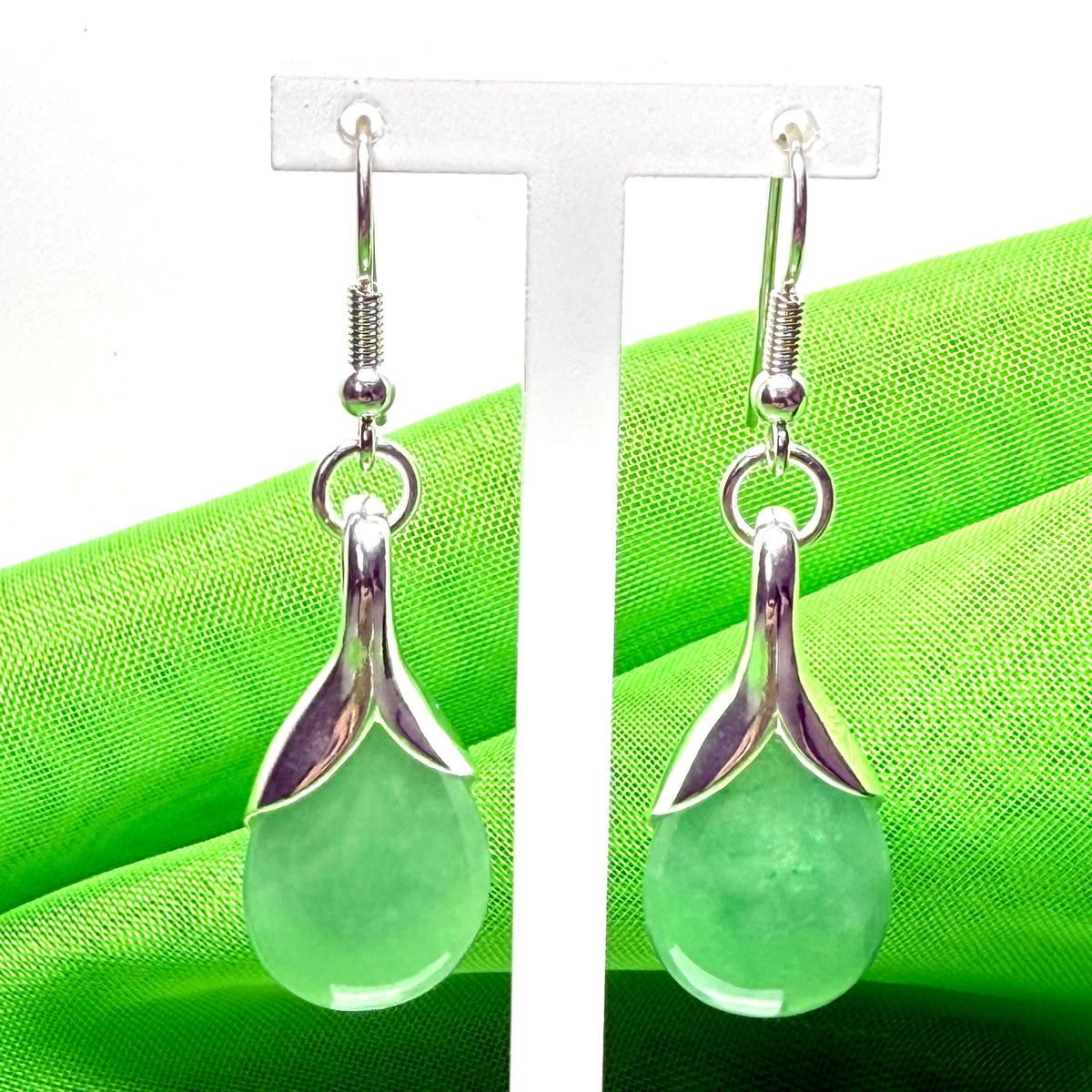 Green real jade teardrop pear shaped drop earrings within sterling silver setting