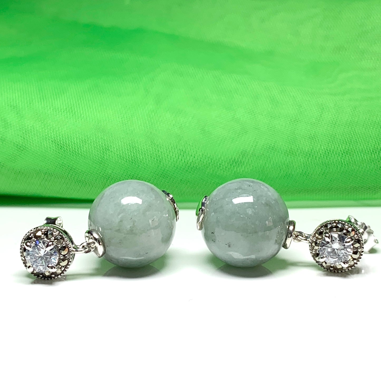 Green jade and cubic zirconia round ball shaped drop earrings