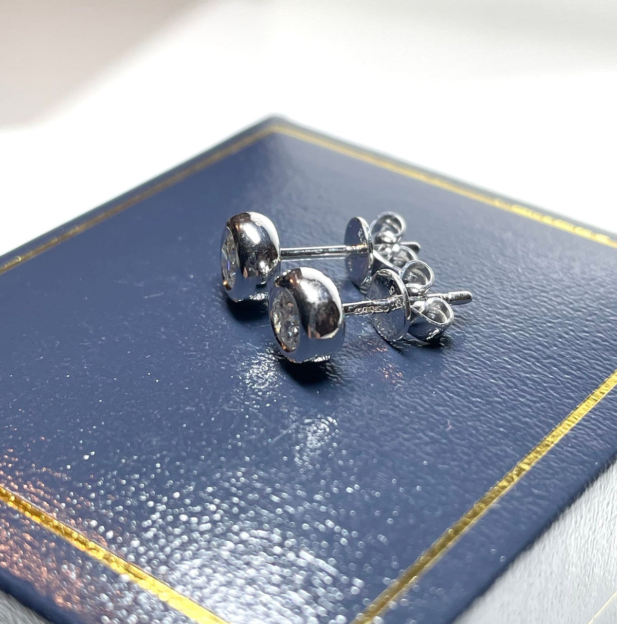 Half Carat Round Diamond Stud Earrings Single Stone Smooth Rubbed Over Setting 50 Points White Gold