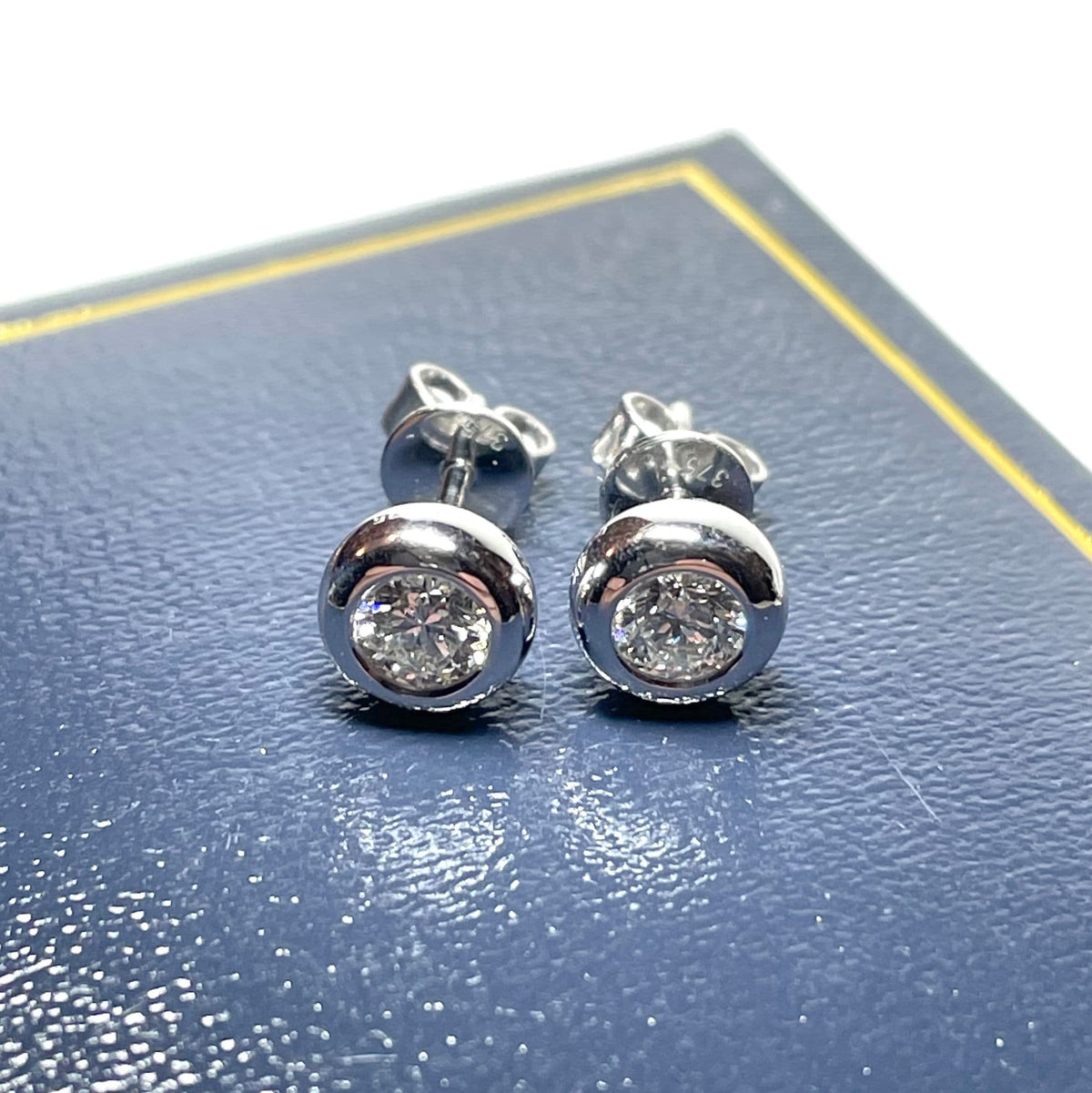 Half Carat Round Diamond Stud Earrings Single Stone Smooth Rubbed Over Setting 50 Points White Gold