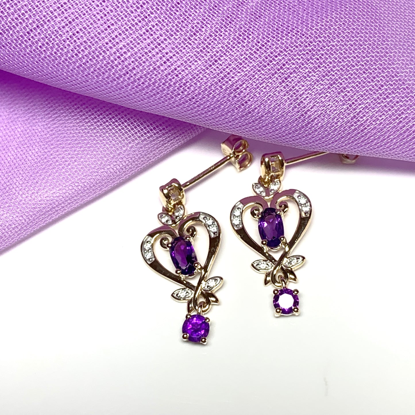 Heart shaped yellow gold and amethyst earrings