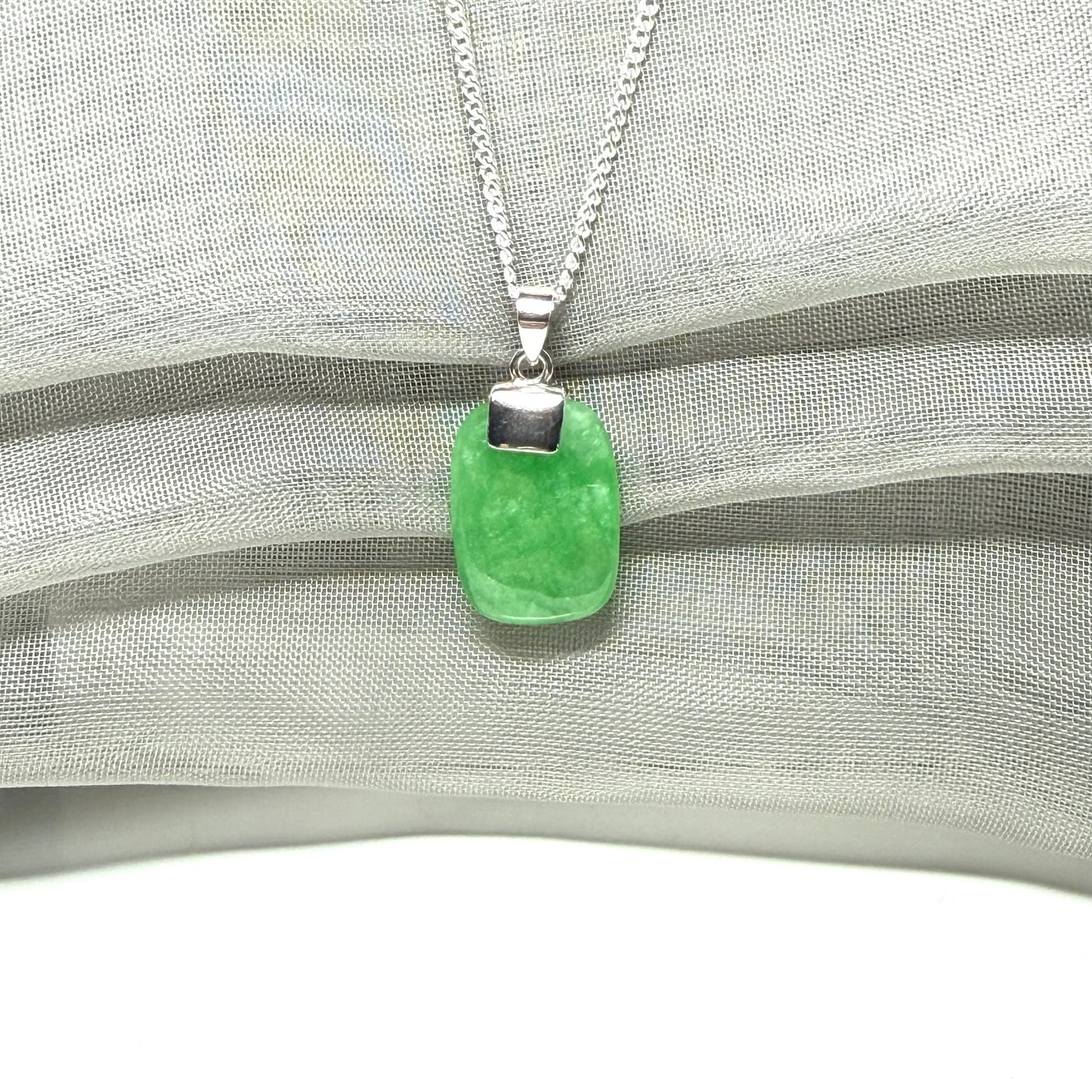 Real green jade necklace cushion shaped silver with a chain, a truly stunning pendant