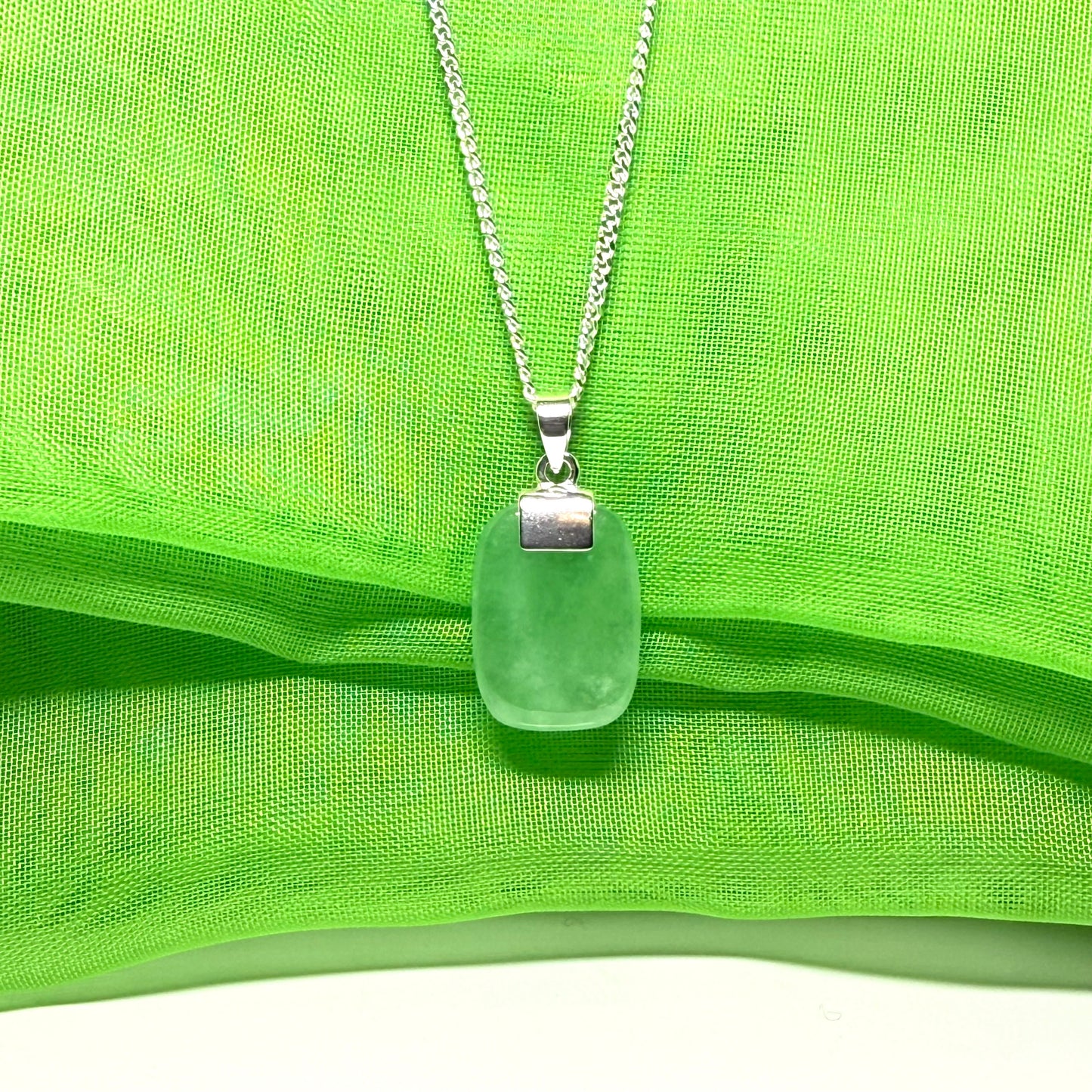 Real green jade necklace cushion shape stone sterling silver, a traditional designed pendant