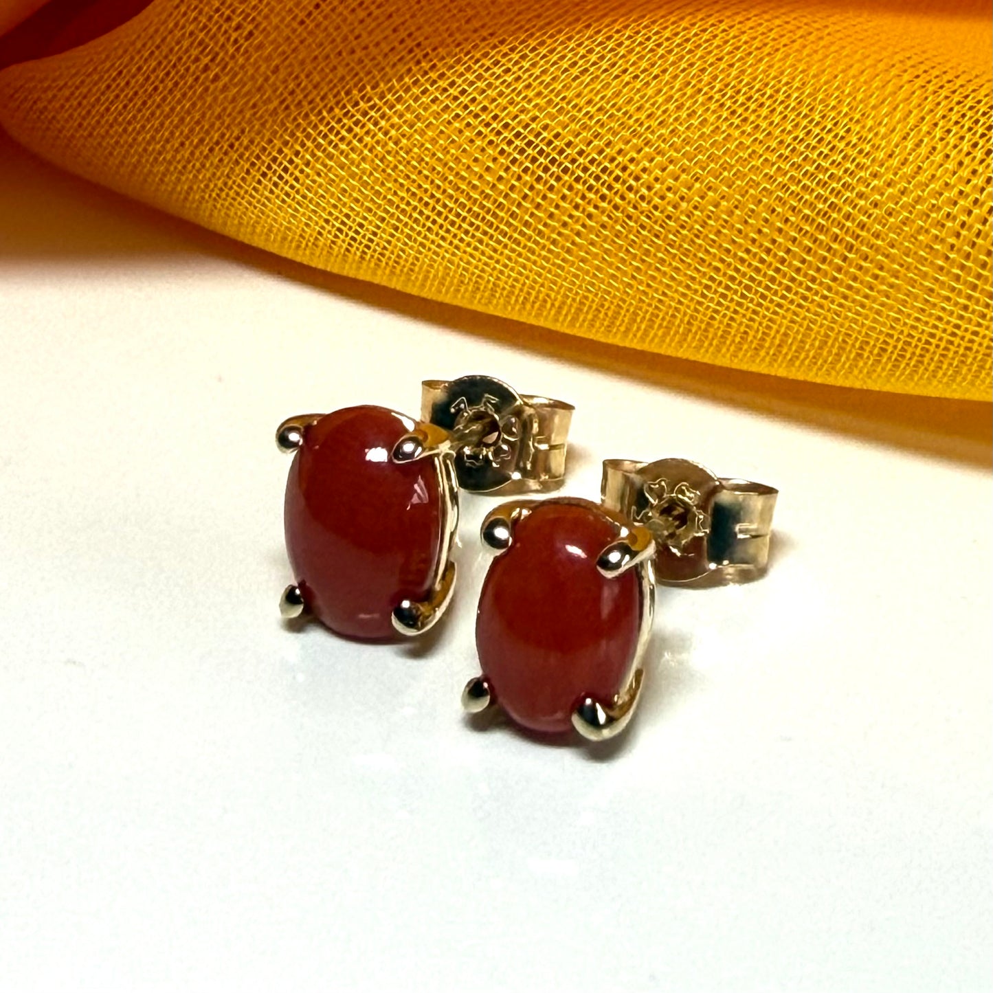 Real coral oval shaped stud earrings yellow gold