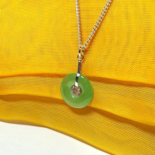Real green jade necklace with a round pendant sterling silver and a chain included
