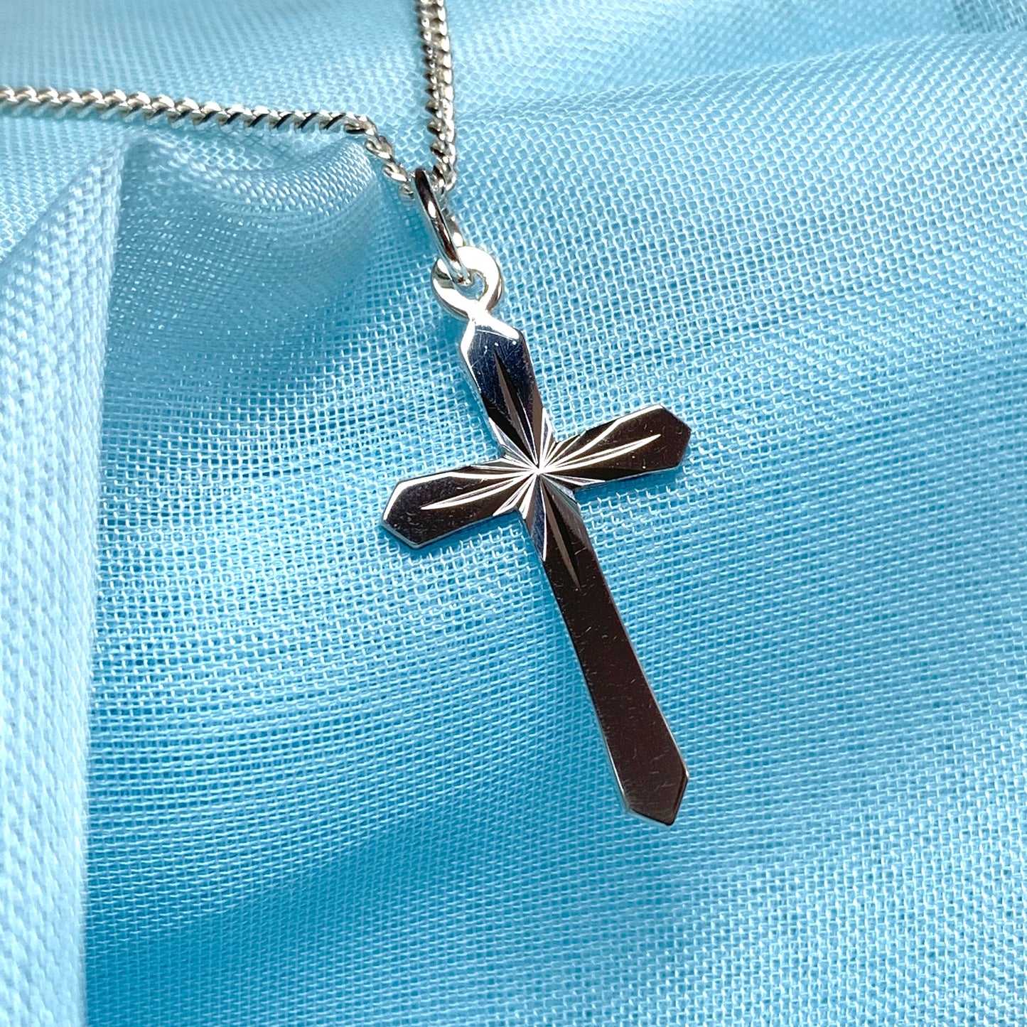 Small sterling silver diamond cut cross necklace including chain