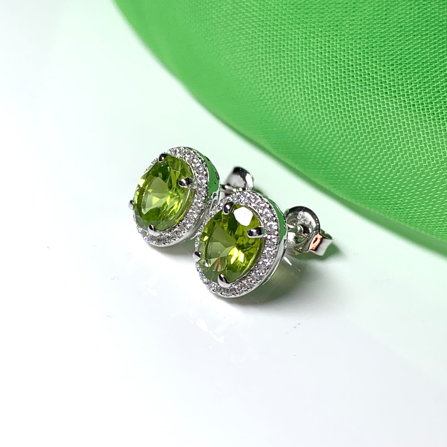 Real peridot and diamond stud earrings oval sterling silver