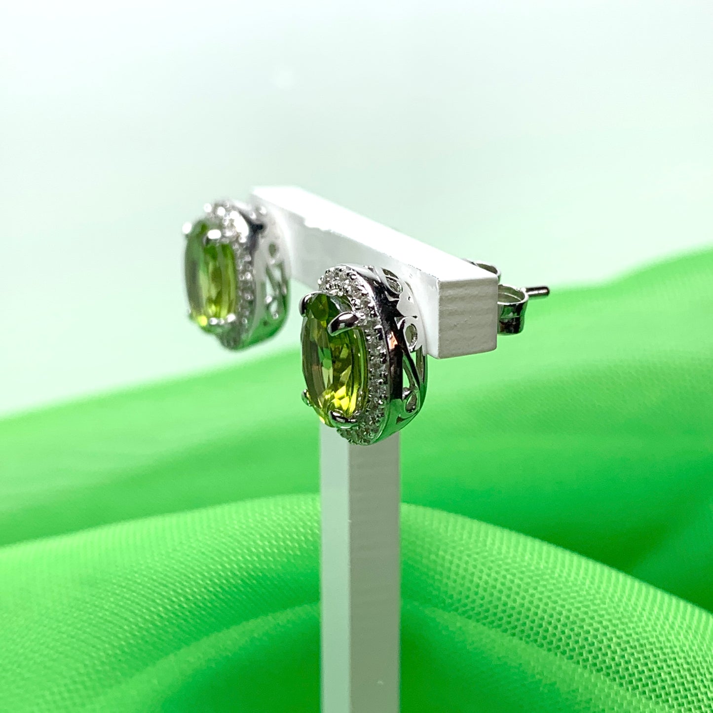 Real peridot and diamond stud earrings oval sterling silver