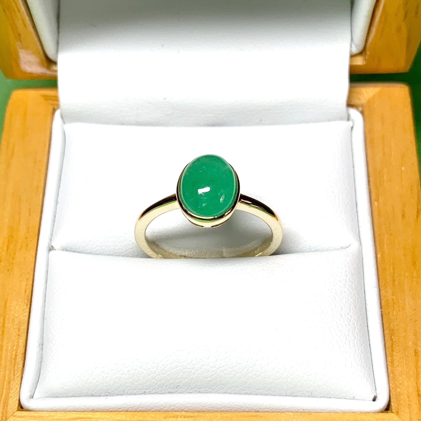 Real jade ring green oval yellow gold smooth rubbed over setting