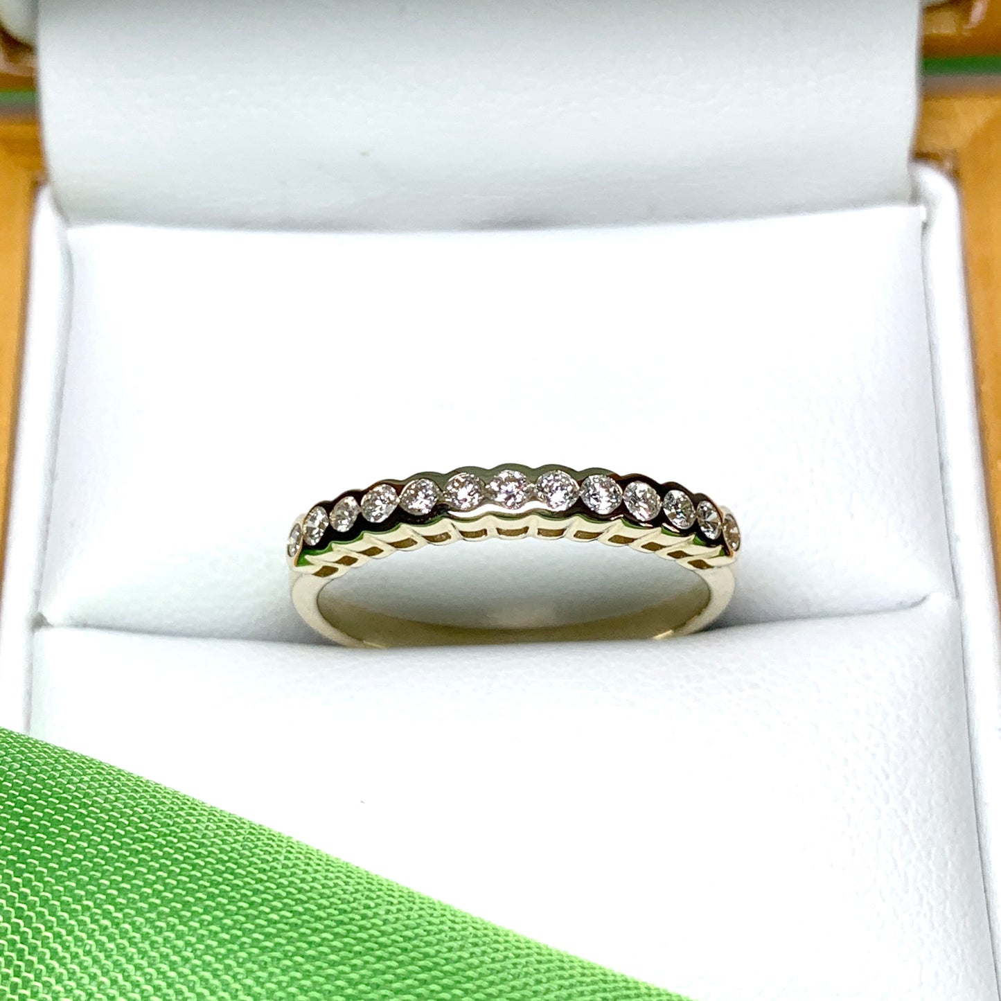 Diamond eternity ring yellow gold smooth rubbed over setting 28 points