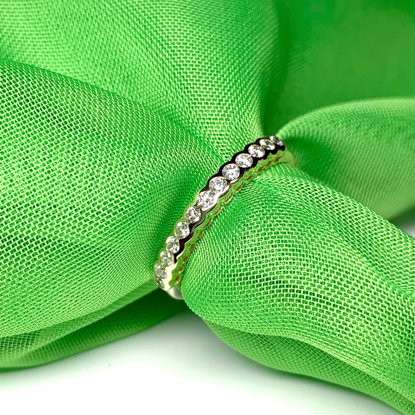 Diamond eternity ring yellow gold smooth rubbed over setting 28 points