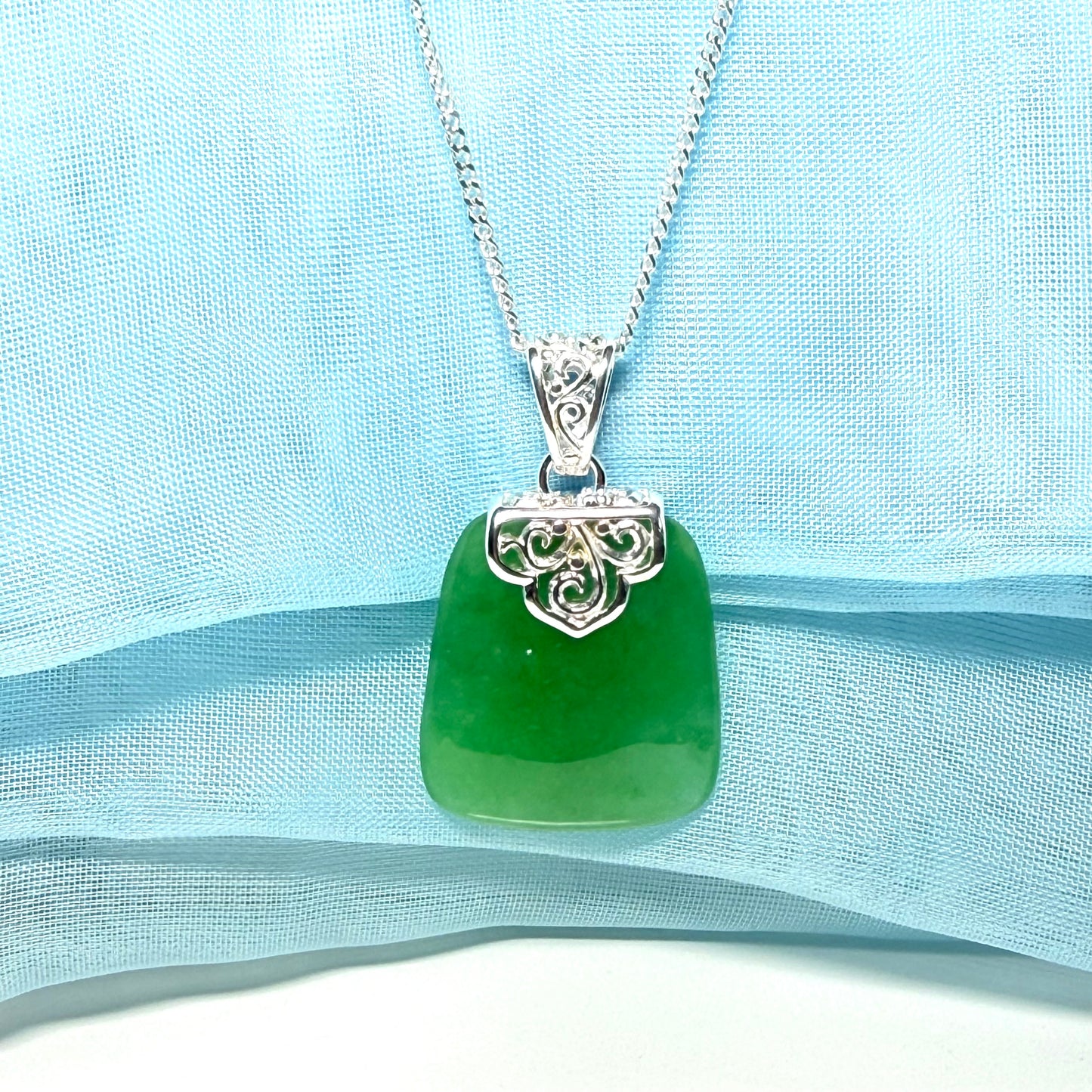 A stunning real jade necklace green sterling silver large cushion shaped, being a really gorgeous design