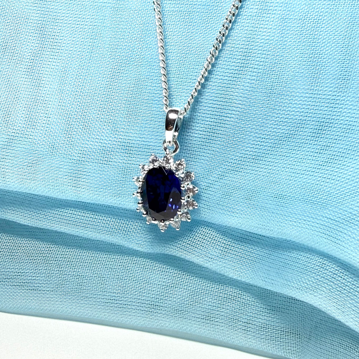 Large necklace deep sapphire blue white cubic zirconia oval cluster