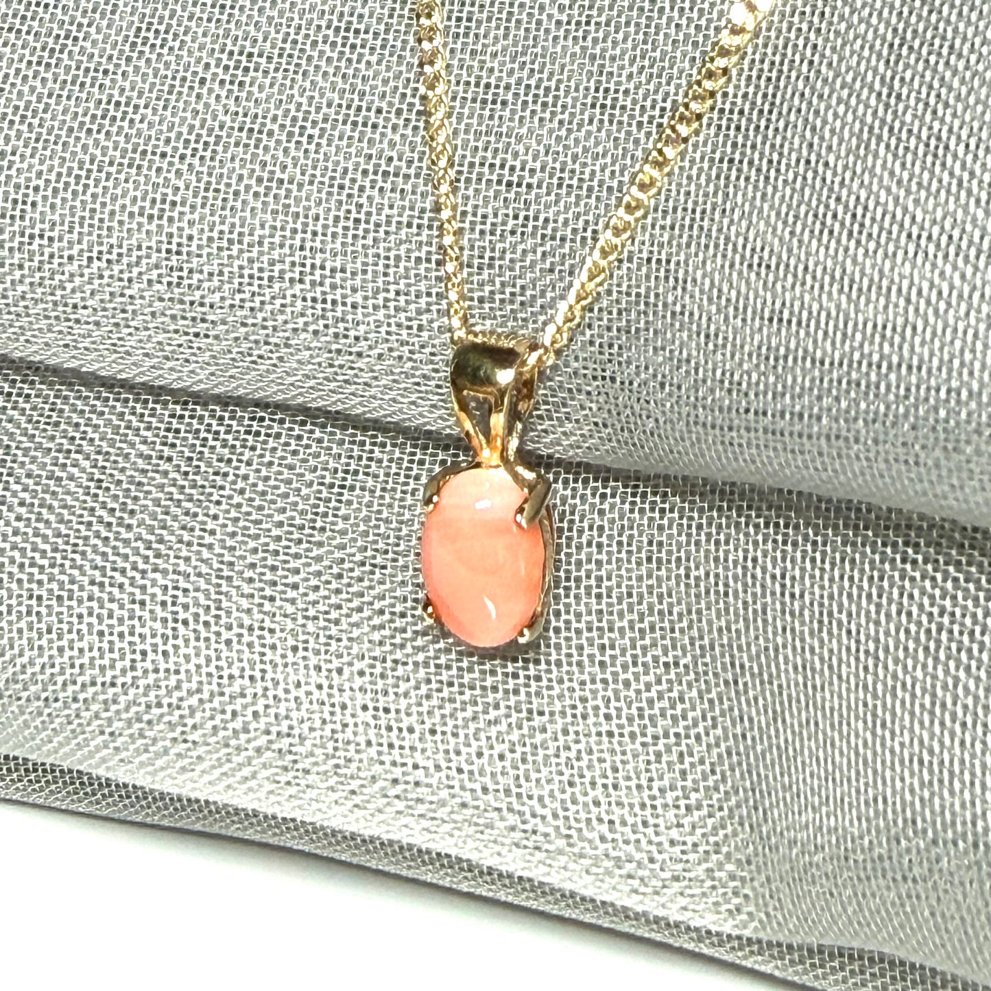 Oval shaped real coral yellow gold necklace pendant with a pierced setting