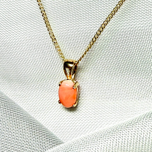 Oval shaped real coral yellow gold necklace pendant with a pierced setting