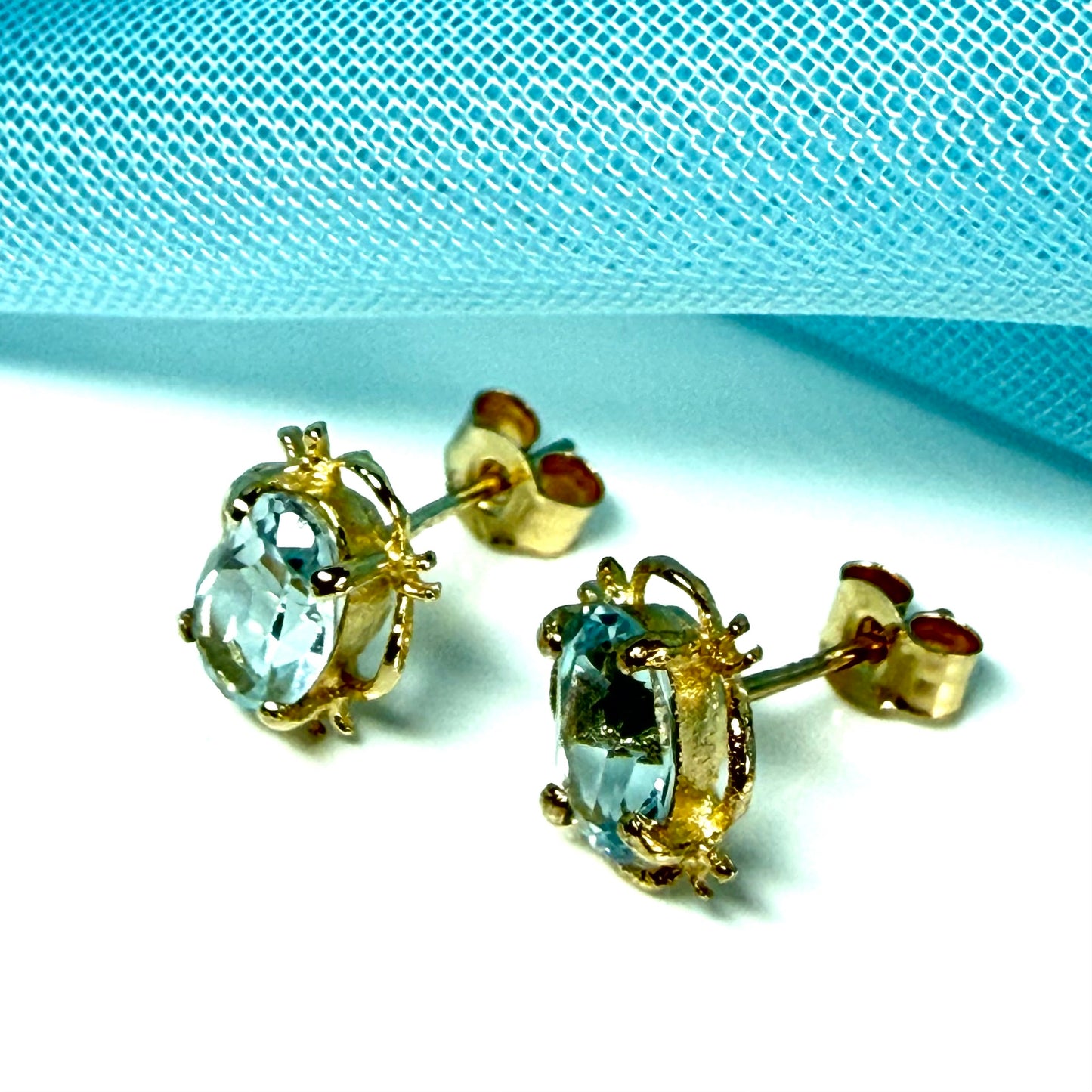 Yellow Gold Light Blue Topaz Stud Earrings Oval Shape