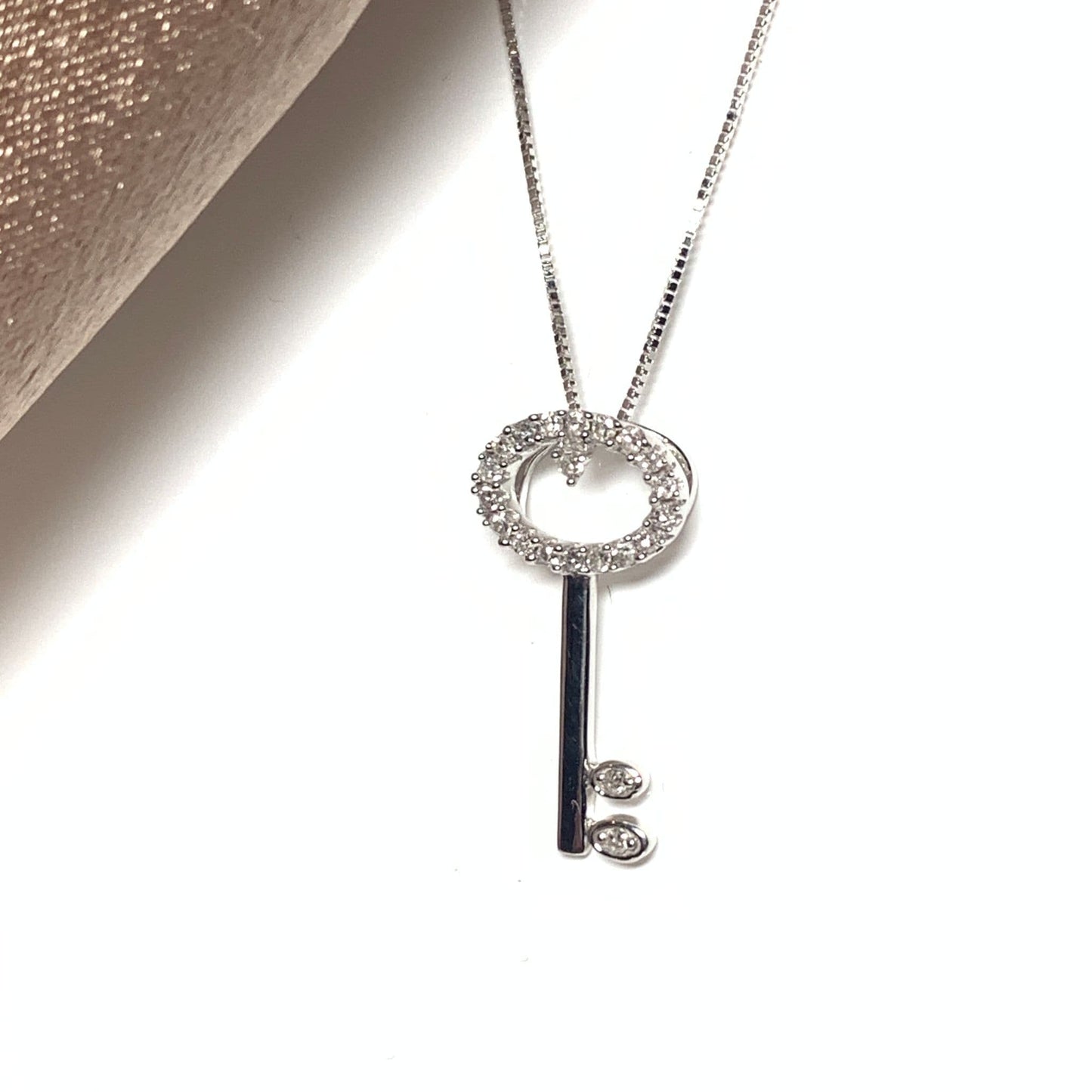 Key shaped diamond necklace pendant