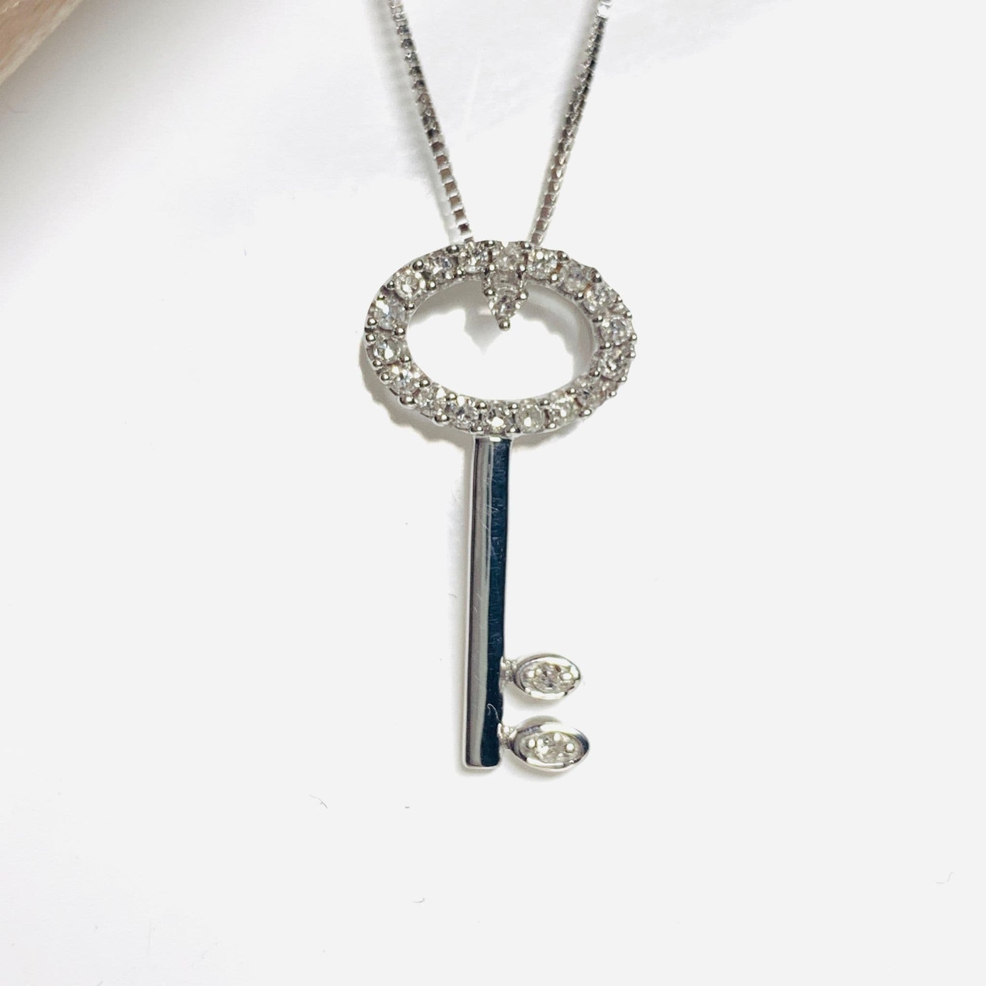 Key shaped diamond necklace pendant