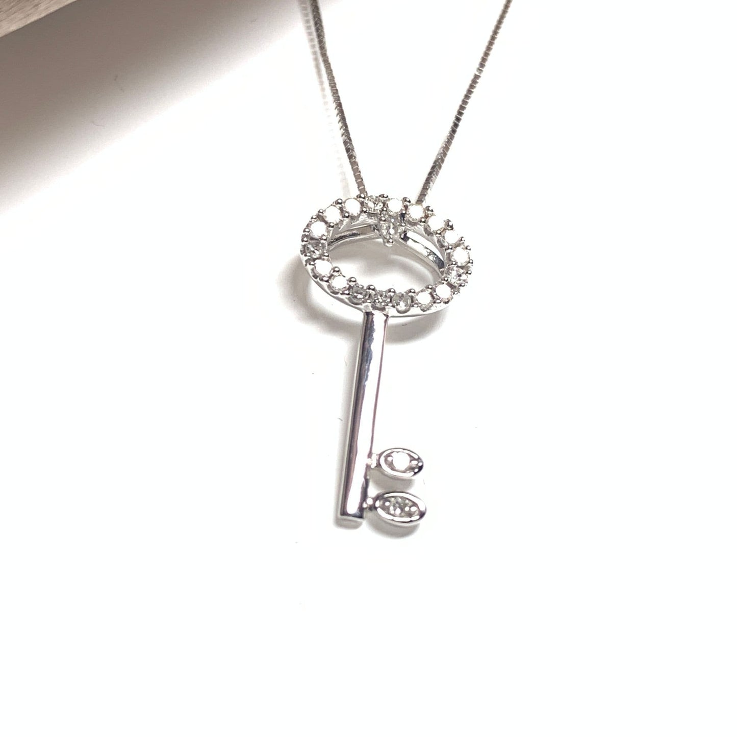 Key shaped diamond necklace pendant