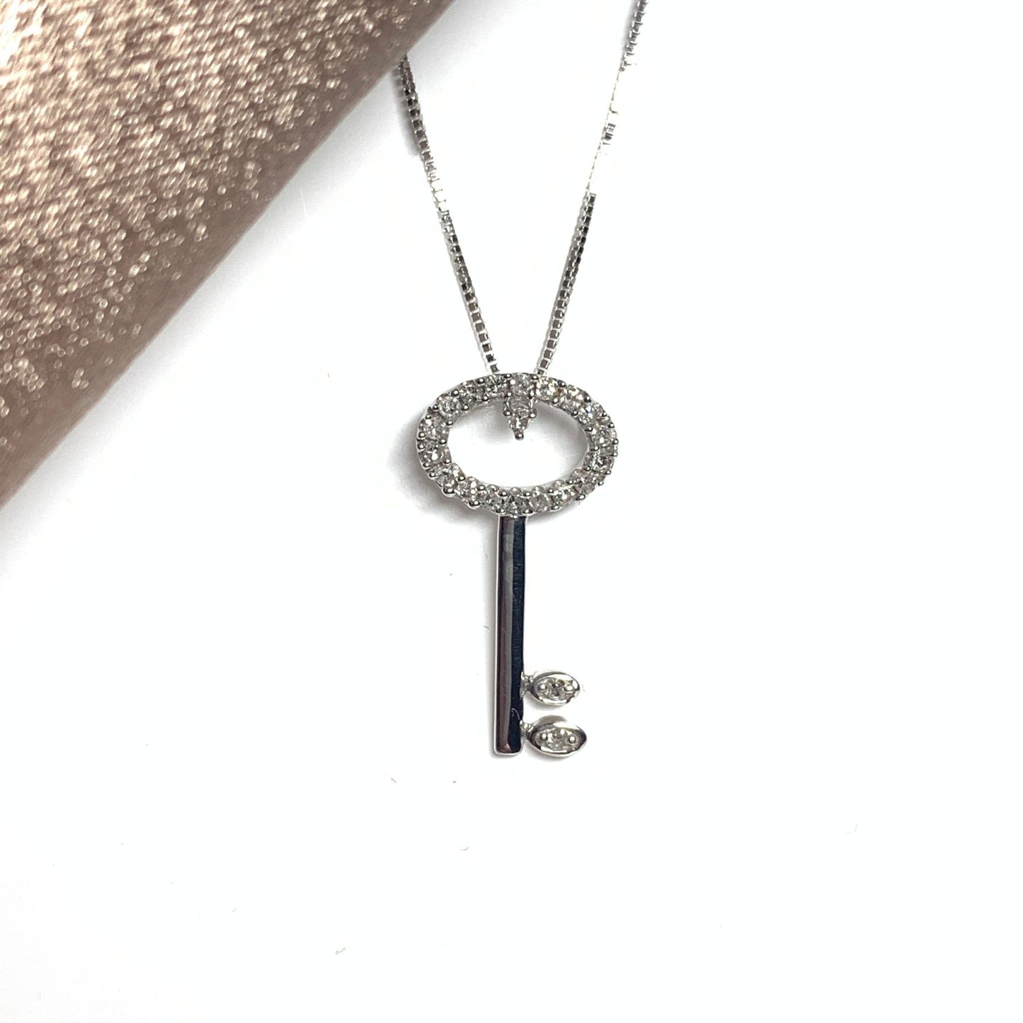 Key shaped diamond necklace pendant