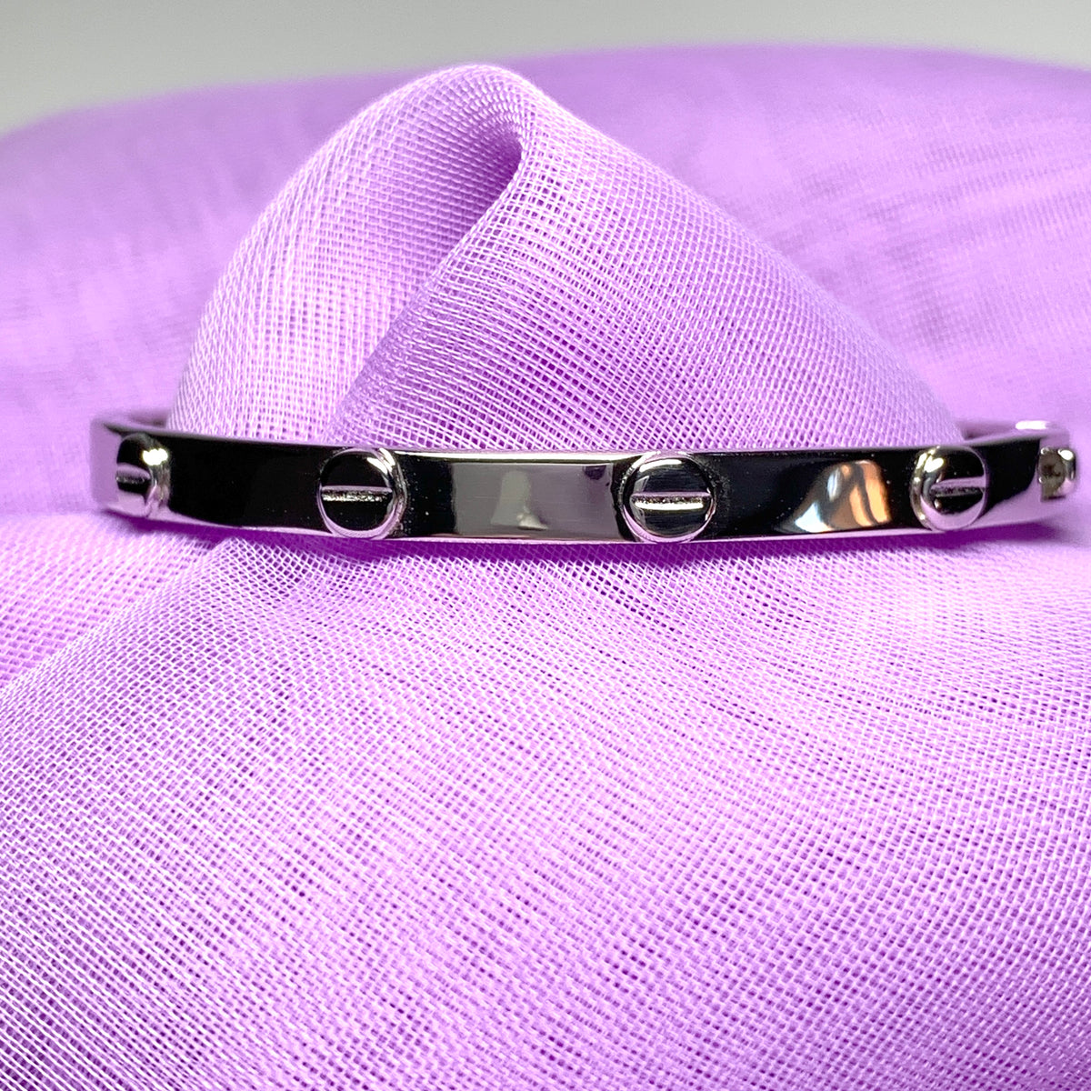 Ladies oval bangle screw head design patterned sterling silver