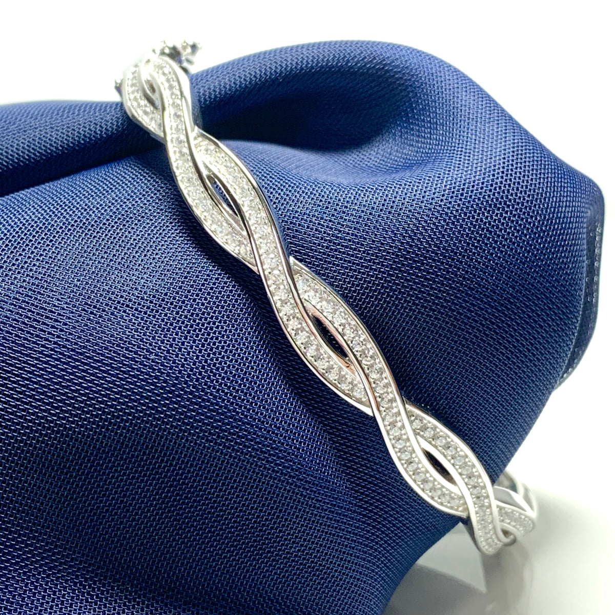 Ladies sterling silver fancy white cubic zirconia bangle twisted