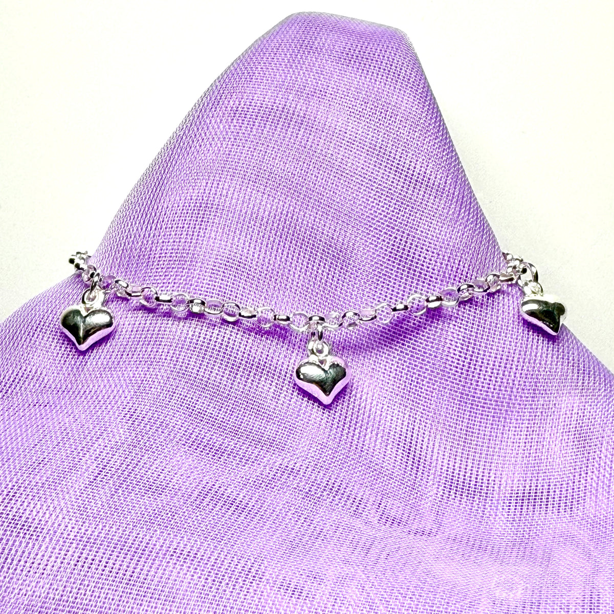 Ladies bracelet four heart shaped charms dangling sterling silver