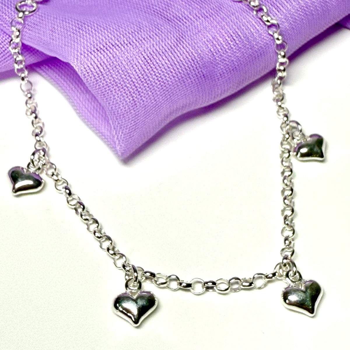 Ladies bracelet four heart shaped charms dangling sterling silver