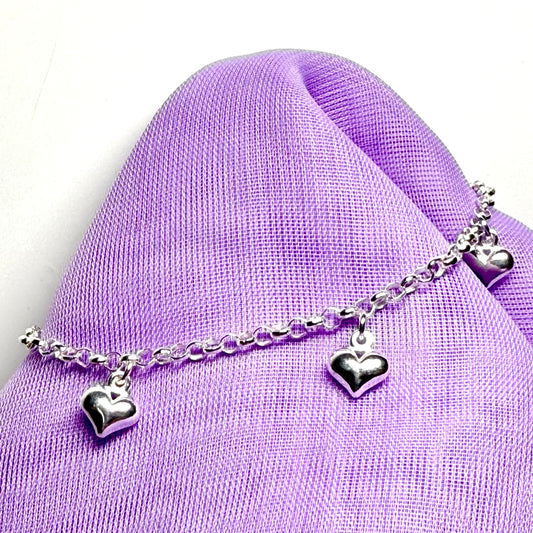 Ladies bracelet four heart shaped charms dangling sterling silver