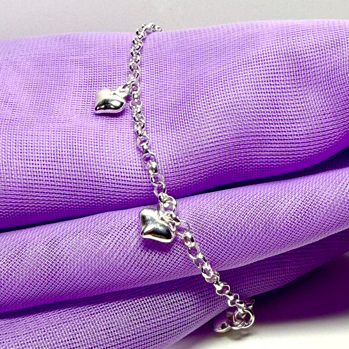 Ladies bracelet four heart shaped charms dangling sterling silver