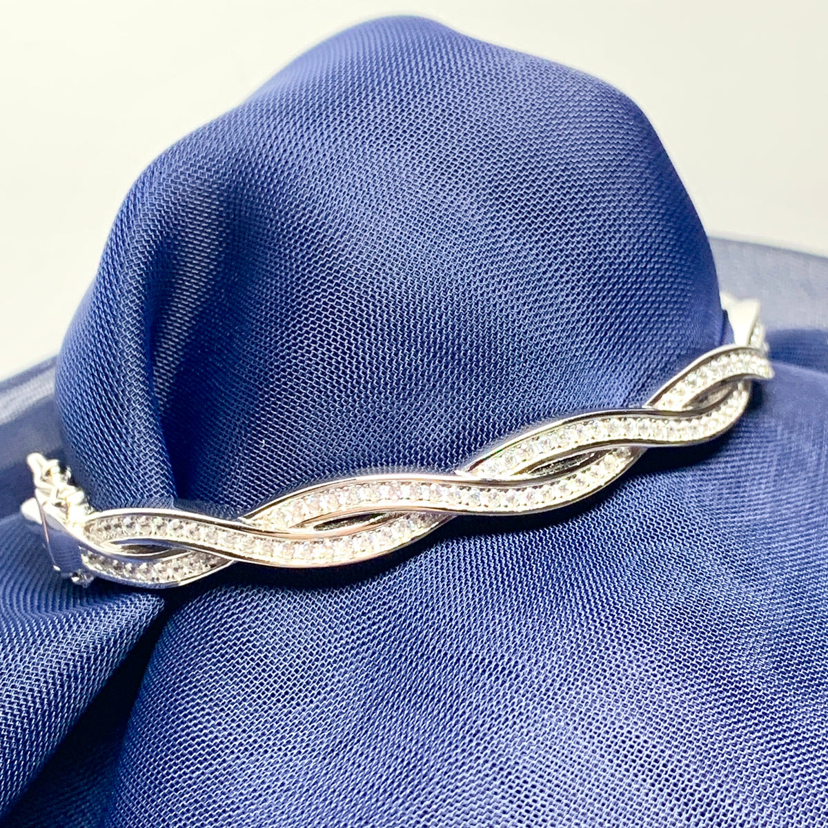Ladies sterling silver fancy white cubic zirconia bangle twisted