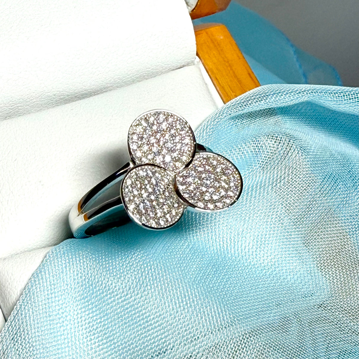 Ladies sterling silver cluster ring with a triple round shaped fancy design