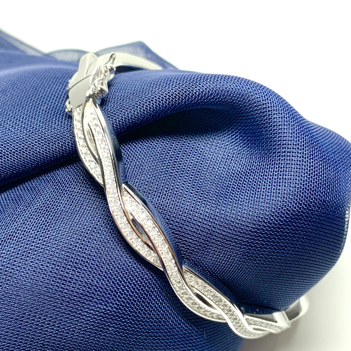 Ladies sterling silver fancy white cubic zirconia bangle twisted