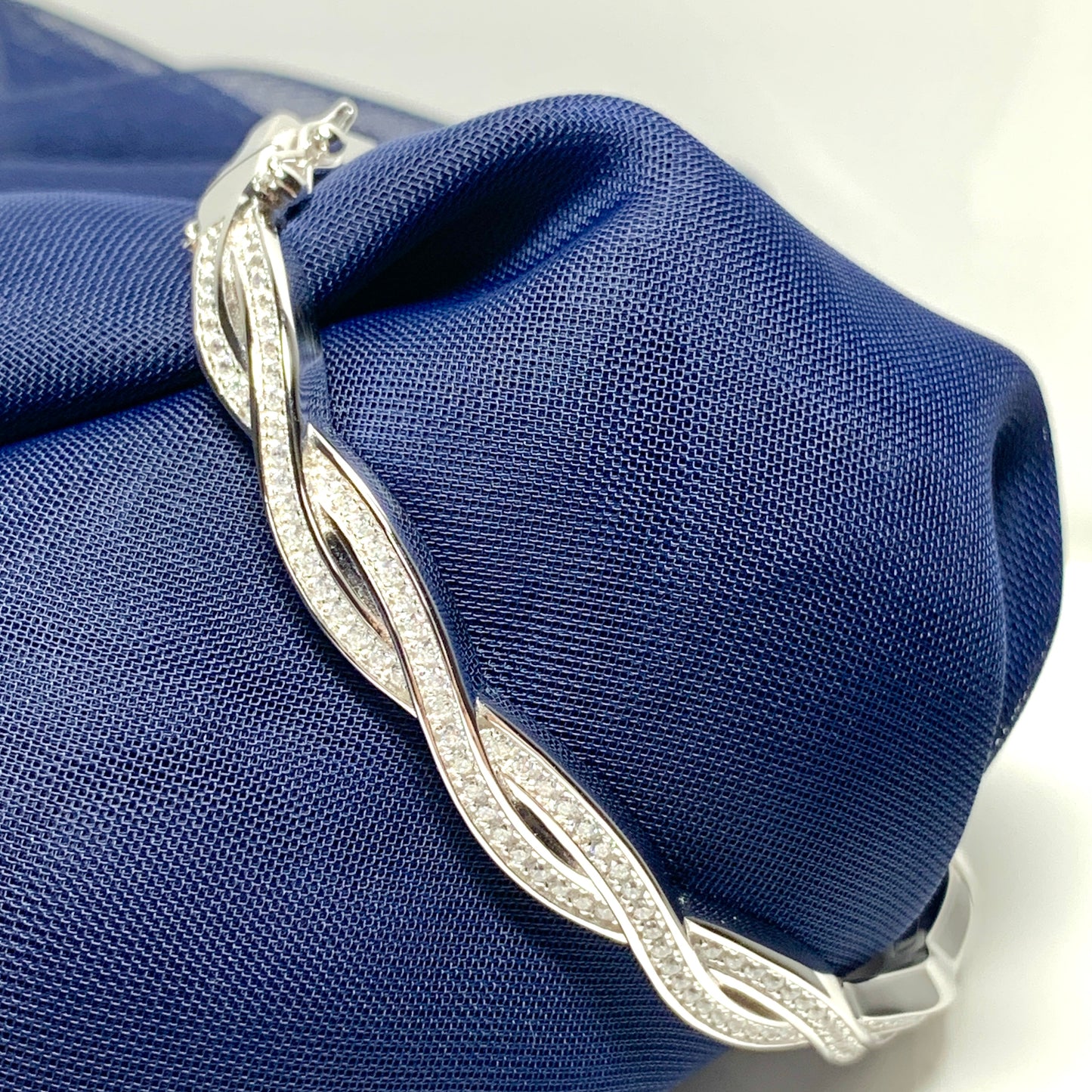 Ladies sterling silver fancy white cubic zirconia bangle twisted