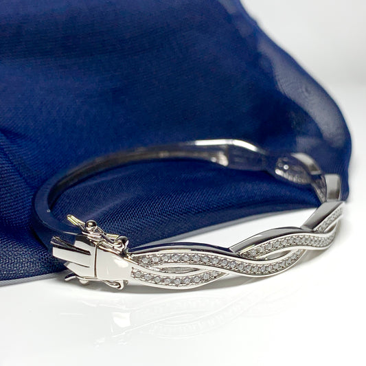 Ladies sterling silver fancy white cubic zirconia bangle twisted