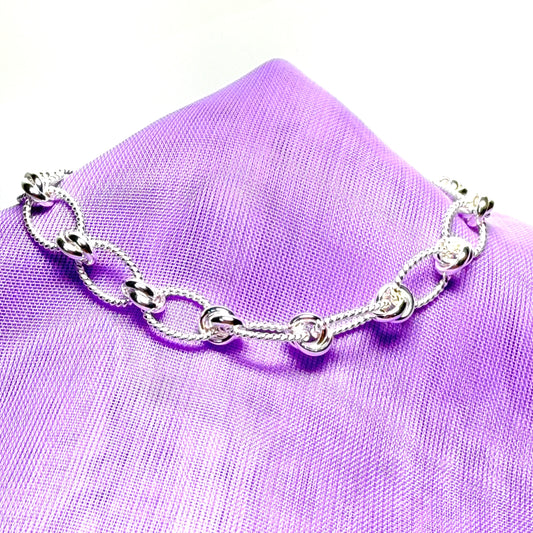 Ladies sterling silver oval rope patterned knotted bracelet solid link