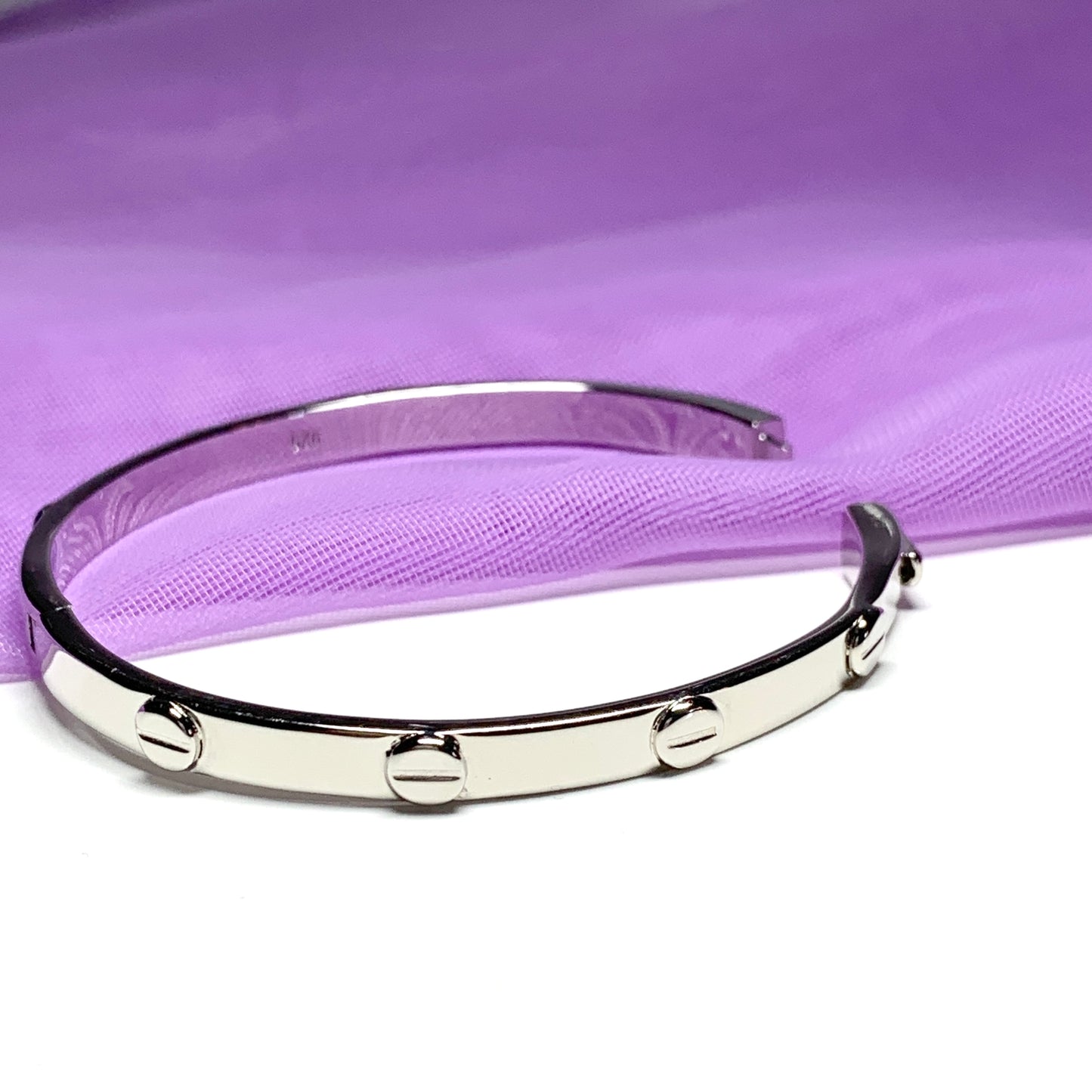 Ladies oval bangle screw head design patterned sterling silver