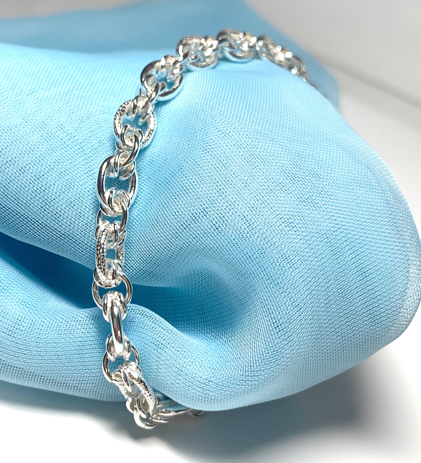 Ladies sterling silver bracelet fancy patterned solid link